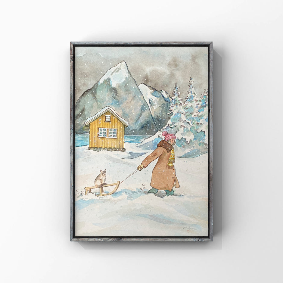 Through the snow - original watercolour painting of a girl pulling a Ragdoll cat on a sledge in the snow