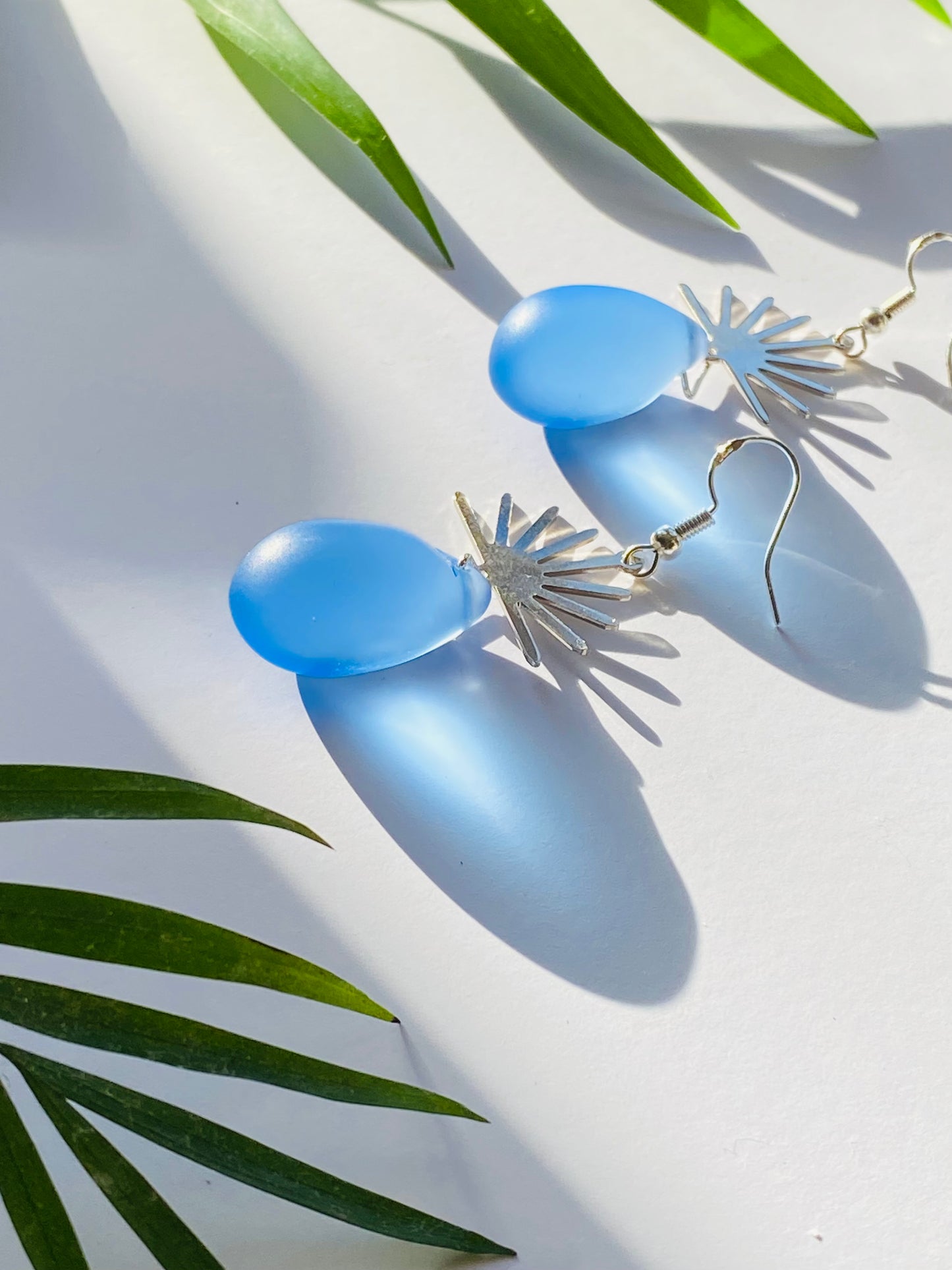 Silver Sun and Blue Glass Teardrop earrings