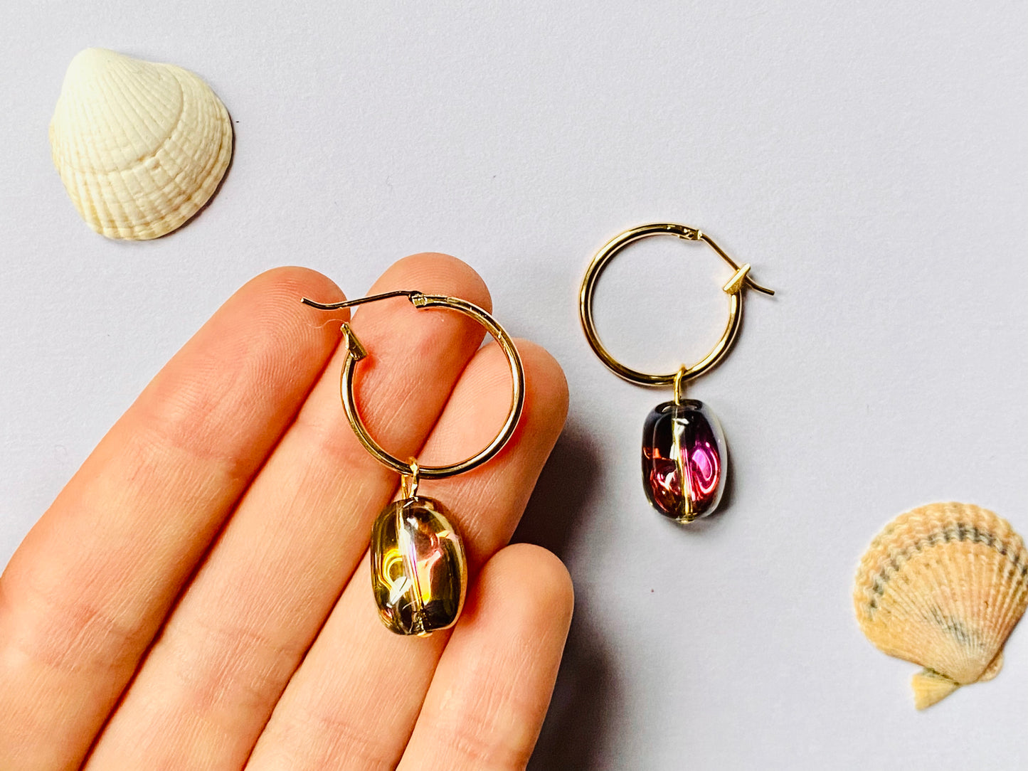 Gold plated hoops with shiny electroplated gold / pink hue glass beans. Perfect gift.