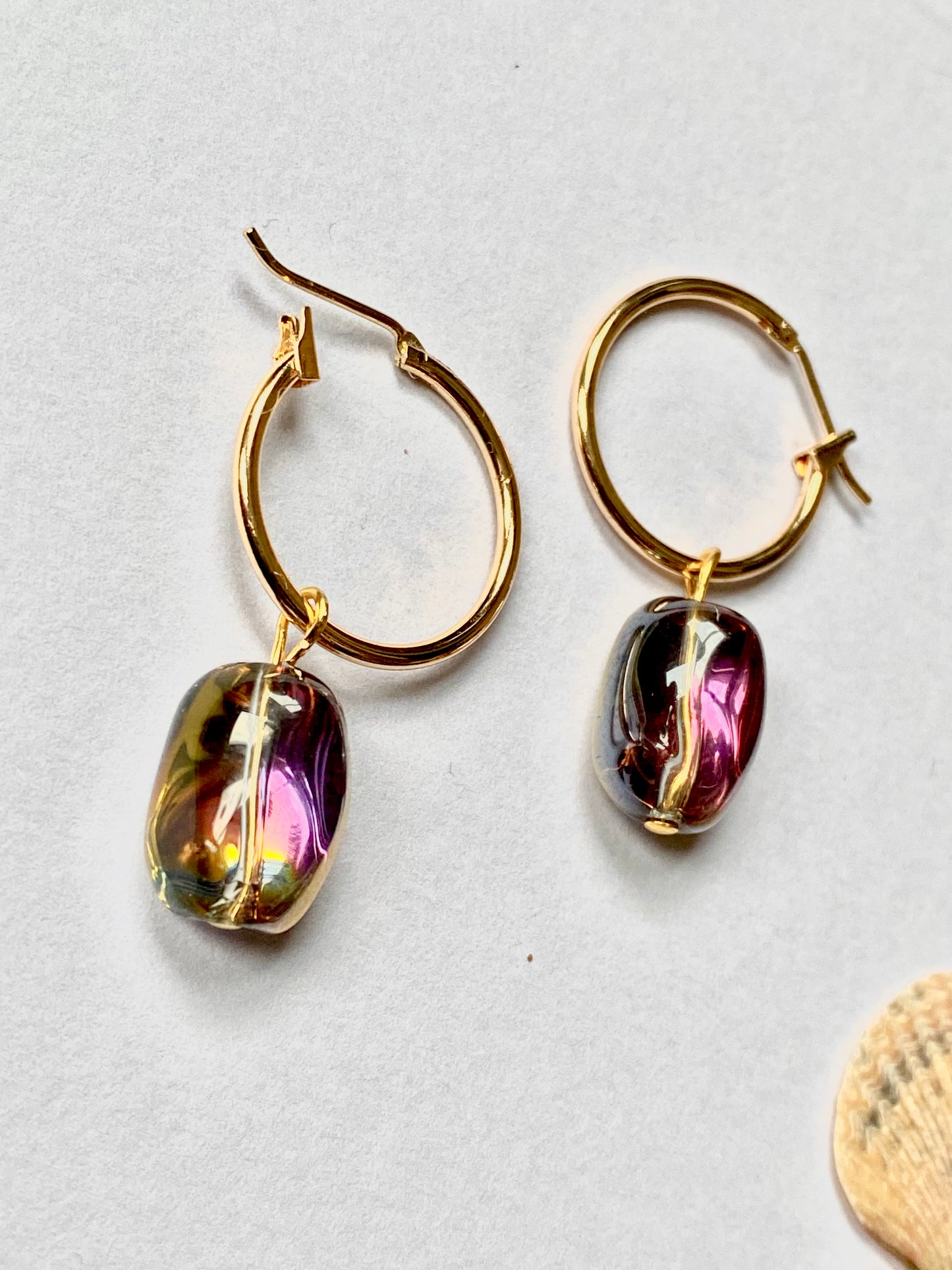 Gold plated hoops with shiny electroplated gold / pink hue glass beans. Perfect gift.