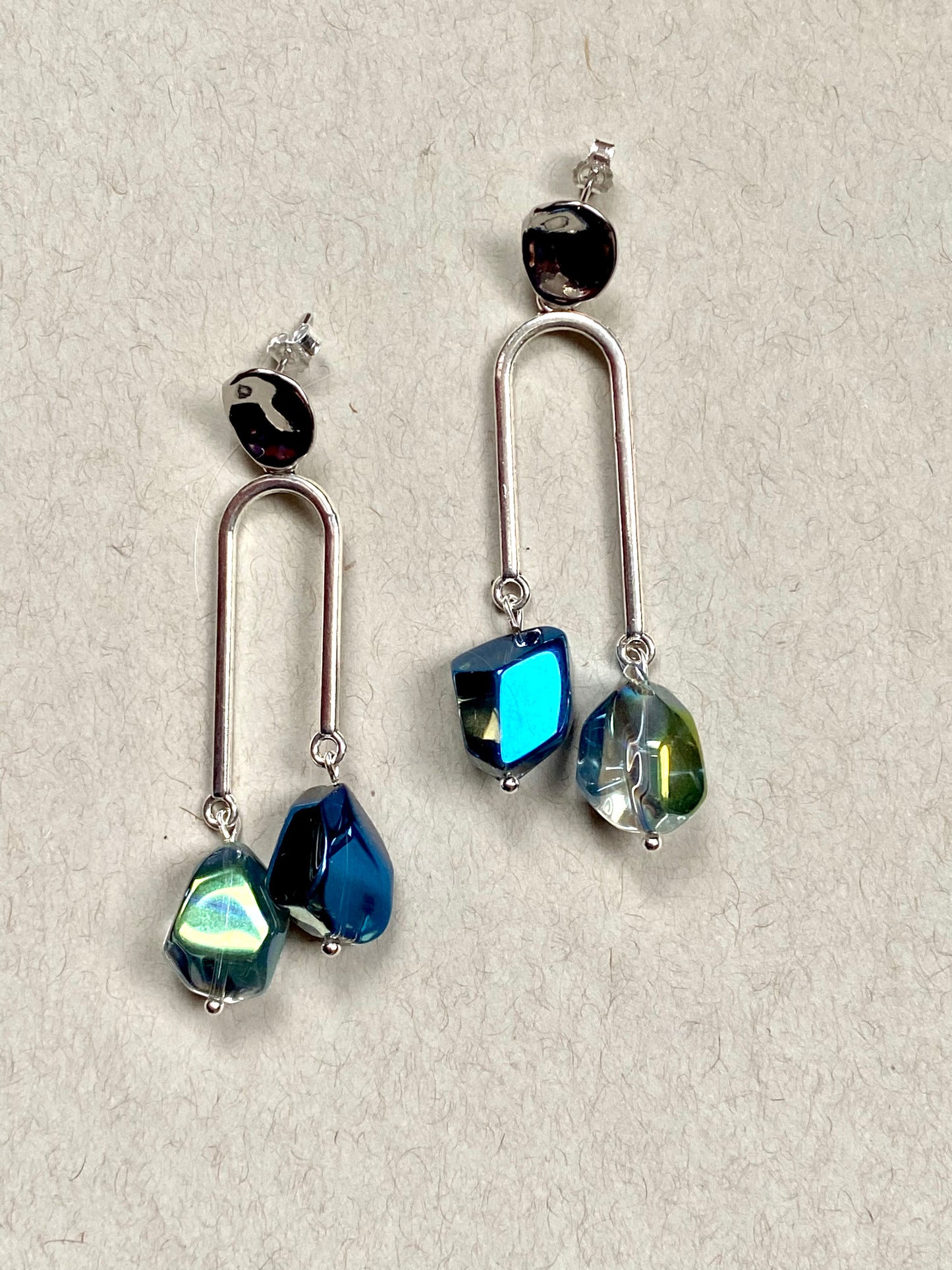 Silver plated geometric asymmetrical drip earrings with shiny unusual nugget electroplated blue / green hue glass beads