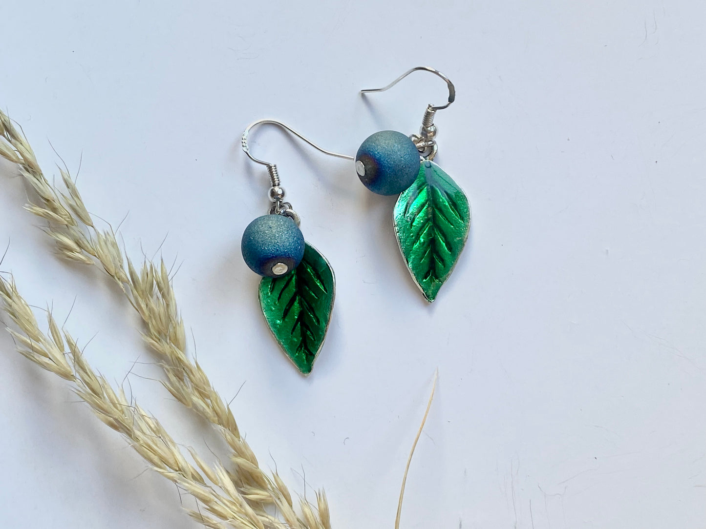 Handmade Sterling silver blueberry Druzy blue electroplated drop earrings with green leaf. Scandinavian nature inspired.