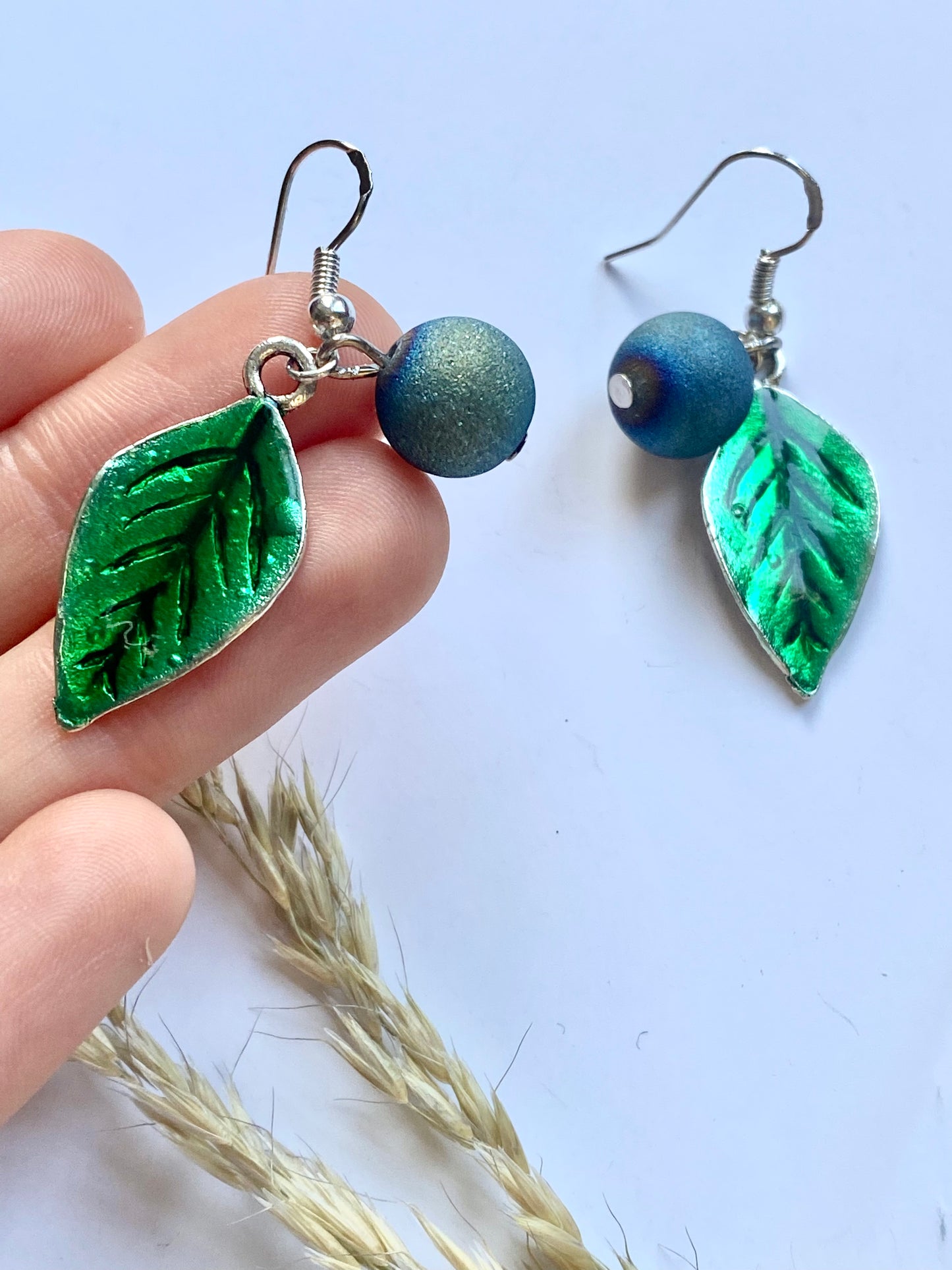 Handmade Sterling silver blueberry Druzy blue electroplated drop earrings with green leaf. Scandinavian nature inspired.